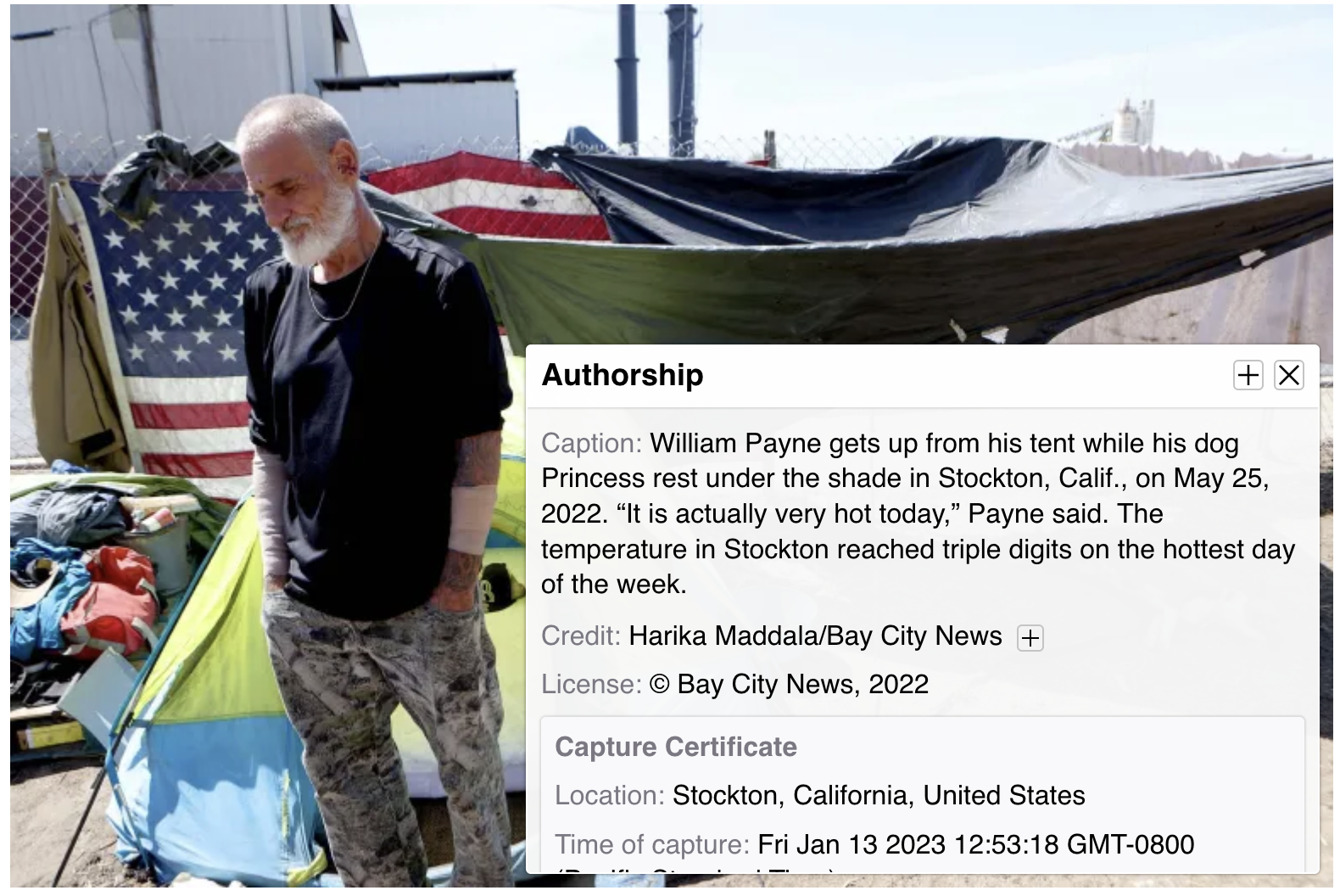 A man standing in front of a tent with metadata overlaying the image